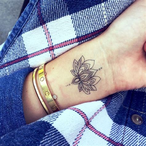 lotus flower tattoo finger|lotus flower wrist tattoo designs.